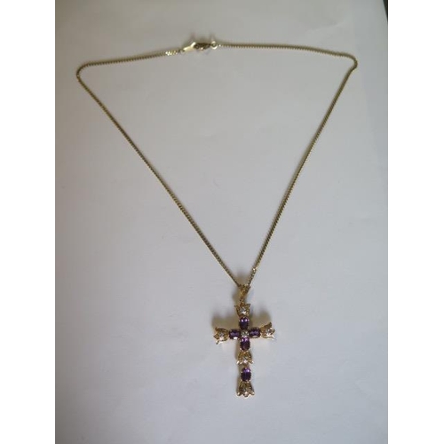 434 - A yellow gold amethyst and diamond crucifix - length 5cm - on a 9ct yellow gold 46cm chain approx we... 