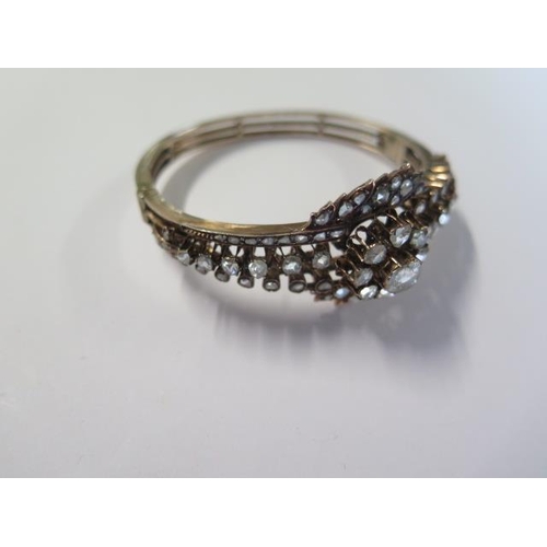 435 - A yellow gold antique diamond bangle set with a central old cut diamond approx 1.00ct surrounded by ... 