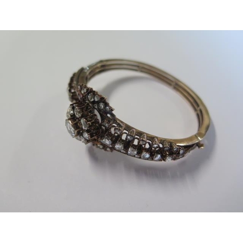 435 - A yellow gold antique diamond bangle set with a central old cut diamond approx 1.00ct surrounded by ... 