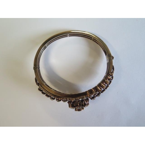 435 - A yellow gold antique diamond bangle set with a central old cut diamond approx 1.00ct surrounded by ... 