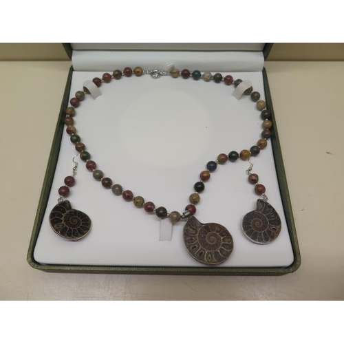 443 - A Jasper and Jurassic Fossil Ammonite necklace and earrings in a presentation box