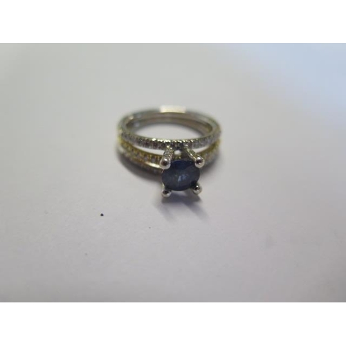 456 - An 18ct gold ring set with a sapphire and diamond chips - ring size L/M - approx weight 6.2 grams