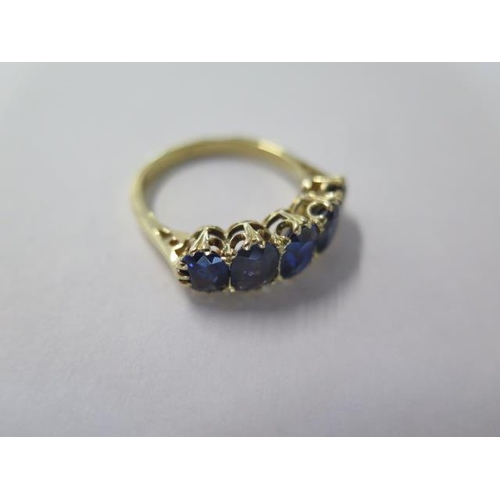 464 - An Edwardian 18ct yellow gold five stone sapphire ring - sapphires are well matched and a good colou... 