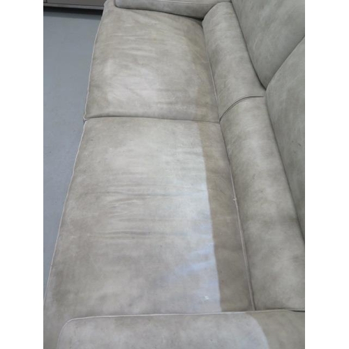 5 - A large Roche Bobois leather sofa, back rests that can be raised, side supports bronze crossed metal... 