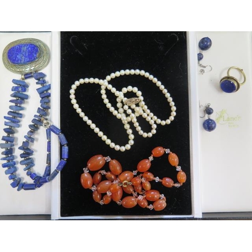 548 - A string of pearls with a 9ct clasp and other jewellery including lapis lazuli