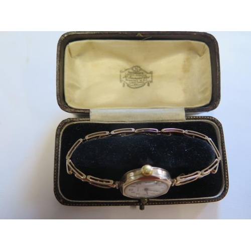 558 - A ladies 9ct gold manual wind watch with 9ct gold sprung bracelet with Rolex movement - boxed - work... 