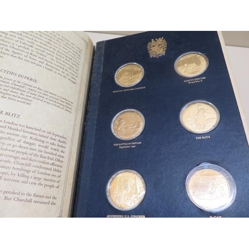 606 - A Churchill Centenary Trust silver gilt medallion collection from John Pinches, 24 medals in a prese... 