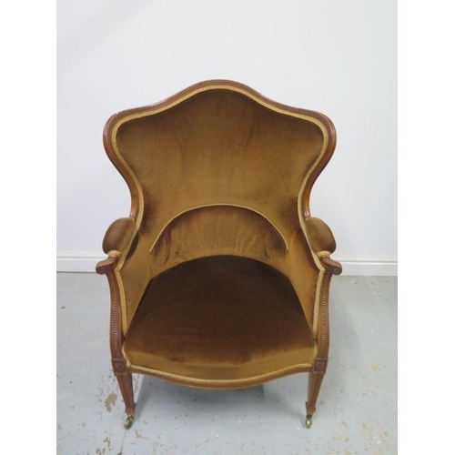 62 - A good quality late Victorian/Edwardian walnut wingback shaped elbow chair with square tapering fron... 