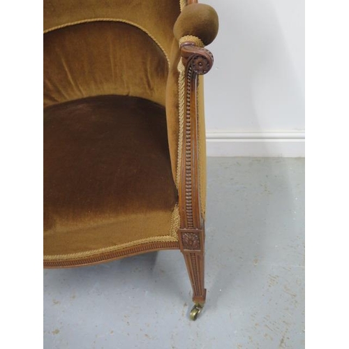 62 - A good quality late Victorian/Edwardian walnut wingback shaped elbow chair with square tapering fron... 