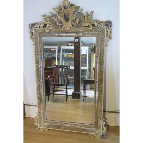 64 - An ornate decorative antique gesso cream and silvered mirror - Height 153cm x Width 91cm - some spot... 