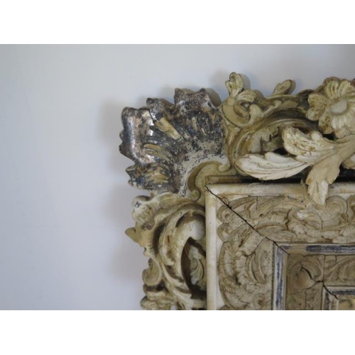 64 - An ornate decorative antique gesso cream and silvered mirror - Height 153cm x Width 91cm - some spot... 