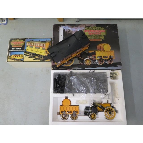 651 - A boxed Stephenson's Rocket Real Steam train 3 1/2 inch gauge and a carriage - both boxed