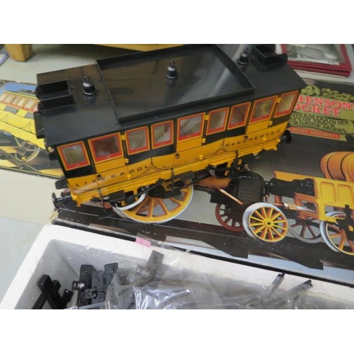 651 - A boxed Stephenson's Rocket Real Steam train 3 1/2 inch gauge and a carriage - both boxed