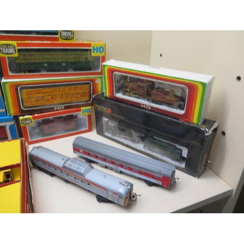 653 - A collection of OO gauge rolling stock and locos including Airfix Tri-ang life like trains - most bo... 