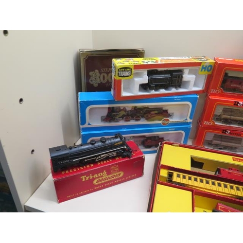 653 - A collection of OO gauge rolling stock and locos including Airfix Tri-ang life like trains - most bo... 