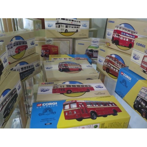 656 - A collection of 24 boxed Corgi Classic buses and trucks