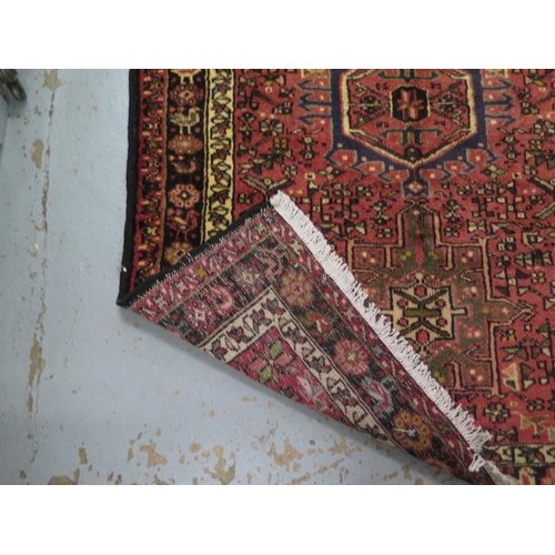 131 - A hand knotted woollen Meimeh rug - 3.23m x 1.10m - in good condition