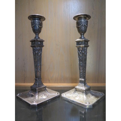 151 - A pair of Adams style silver weighted single candlesticks - Sheffield 1903/04 - Martin Hall & Co Ltd... 