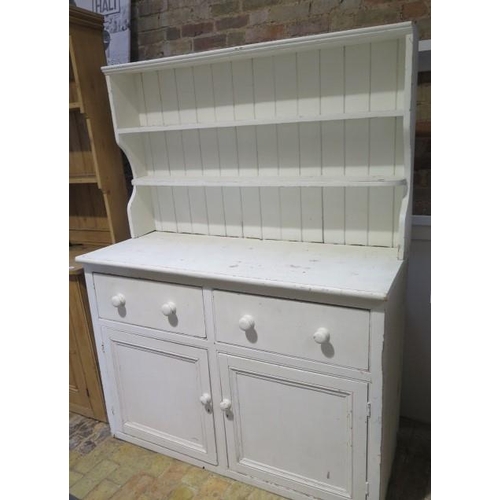 510 - A shabby chic painted pine dresser with an open rack top above a two door two drawer base - Height 1... 