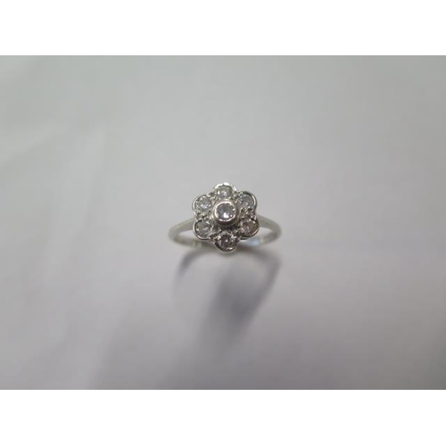 44 - An 18ct white gold seven stone diamond cluster ring, brilliant cut diamonds, approx total carat weig... 