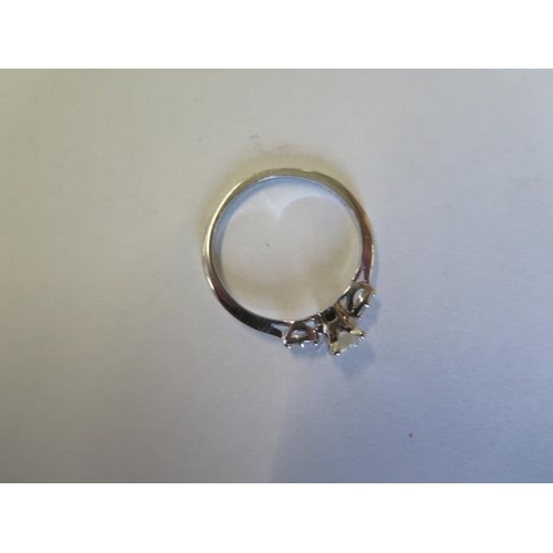 55 - A 14ct white gold five stone diamond ring, centre stone approx half carat - head size approx 5.2mm x... 
