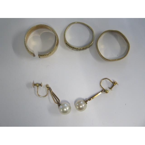 12 - Three 9ct yellow gold rings (one cut) and a pair of 9ct pearl earrings - total weight approx 11 gram... 