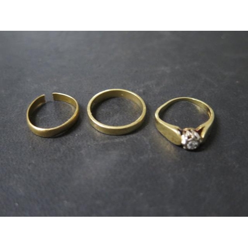 13 - Two 18ct yellow gold rings - approx weight 7 grams - and a cut 22ct ring approx weight 1.9 grams