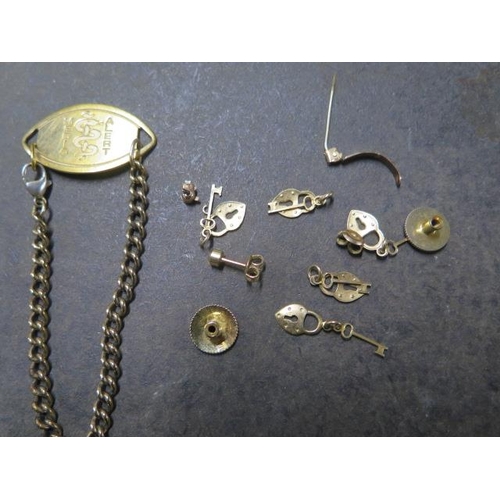 146 - A 9ct gold chain, 9ct bar brooch, pair of 9ct studs and an earring - approx 11 grams in total - a gi... 