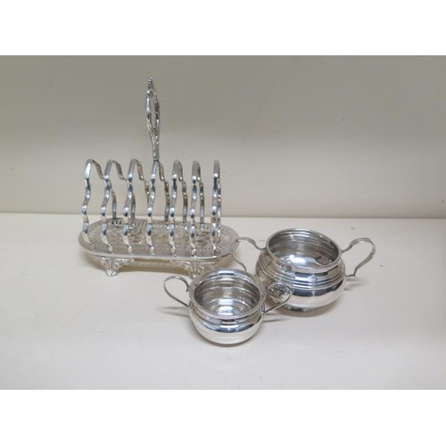 156 - Two silver twin handle bowls - 6cm and 5cm tall - total approx weight 4 troy oz - and a plated toast... 