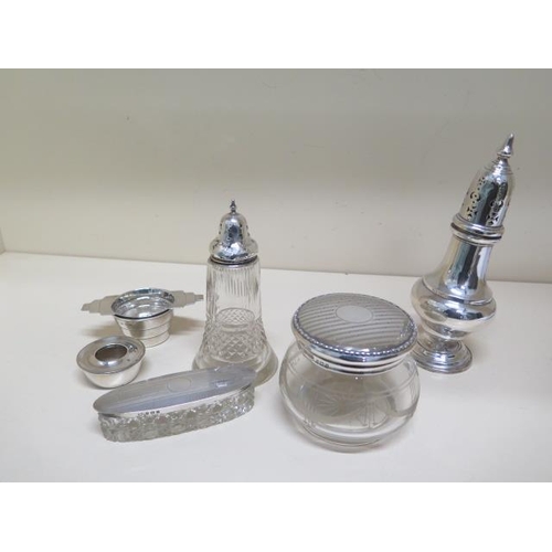160 - A silver sifter - Height 19cm - dented base - three silver top bottles/tidies - glass good - a silve... 