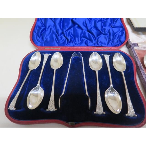 182 - Three boxed sets of silver spoons, a part set of enamel and silver spoons, a posy holder and a pair ... 