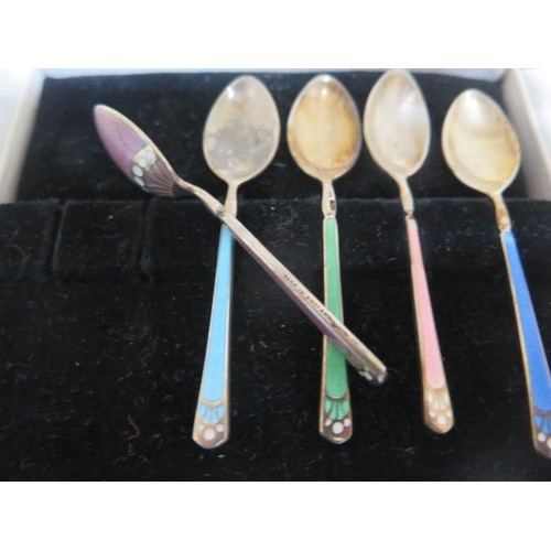 182 - Three boxed sets of silver spoons, a part set of enamel and silver spoons, a posy holder and a pair ... 