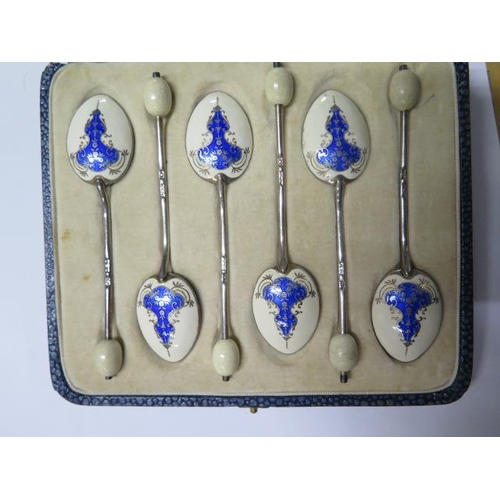 185 - A set of six pretty silver and enamel spoons retailed by Harrods