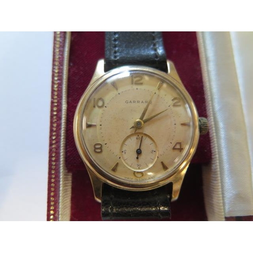 200 - A 9ct yellow gold Garrard manual wind presentation wristwatch - 33mm case - in running order with bo... 