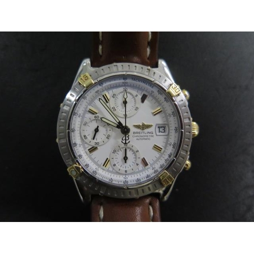209 - A Breitling stainless steel and gold chronograph wristwatch B13352 - with a 38mm case and white dial... 