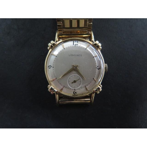 210 - A 9ct yellow gold Longines manual wind wristwatch on a 9ct bracelet strap, 28mm case - approx total ... 