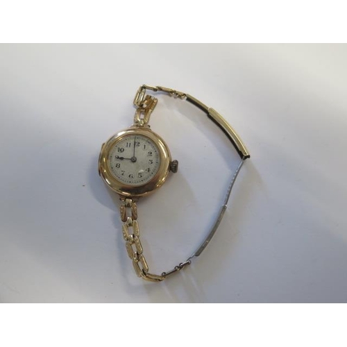 212 - A Rolex 9ct yellow gold wristwatch manual wind, 27mm case on a rolled gold strap - not working - app... 