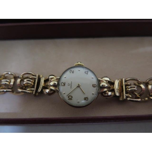 216 - A continental gold Omega ladies manual wind  wristwatch on a plated bracelet strap - 18mm case - in ... 