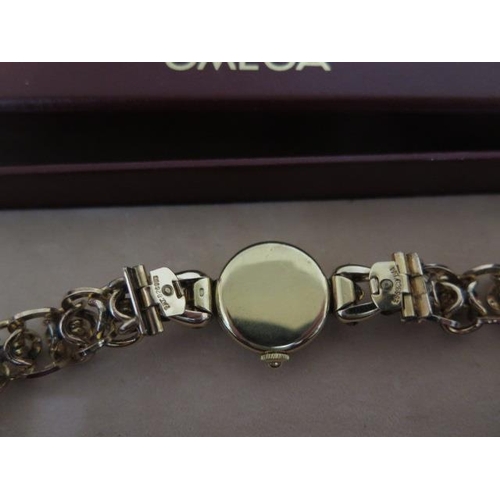 216 - A continental gold Omega ladies manual wind  wristwatch on a plated bracelet strap - 18mm case - in ... 