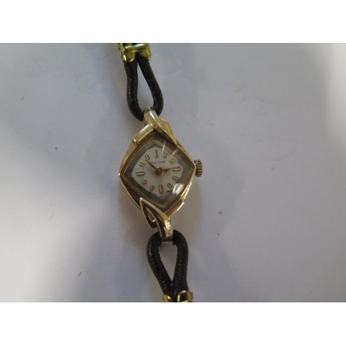 217 - A Bulova 10ct yellow gold manual wind ladies wristwatch - 16mm case - running - total approx weight ... 