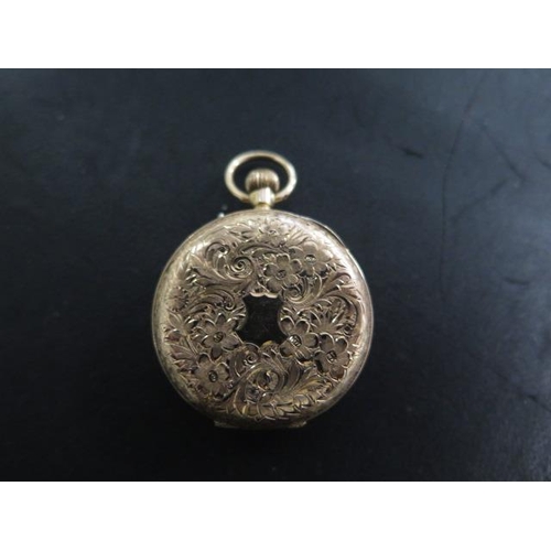 218 - A 10ct 625 gold top wind pocket watch - 33mm case - with enamel dial - in running order - approx wei... 