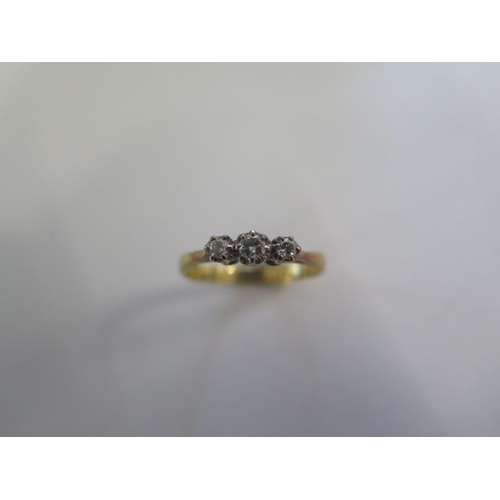 22 - An 18ct yellow gold three stone diamond ring size P - diamonds bright - approx weight 3 grams