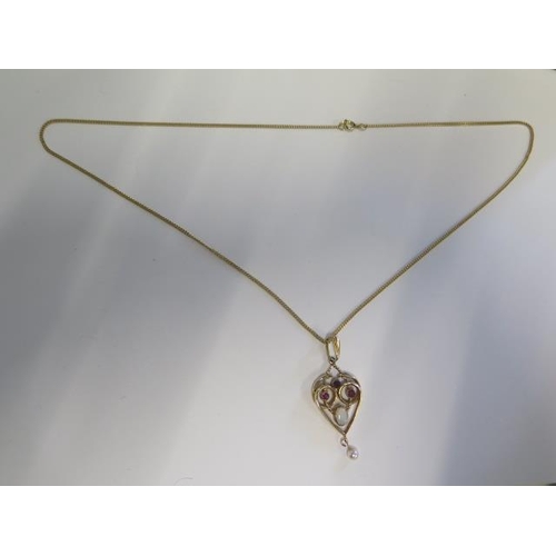 26 - A hallmarked yellow gold garnet, opal and pearl pendant on a hallmarked 9ct yellow gold chain - 50cm... 