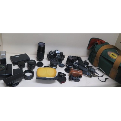 265 - A Nikon FM2 35mm camera, 4 lens Nikon Nikkor 50mm, Nikon Nikkor 135mm, Nikon Nikkor 28mm, Tokina 300... 