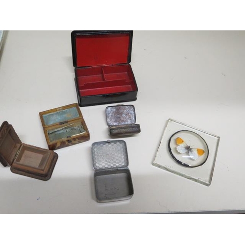 267 - A collection of five small boxes and a paperweight