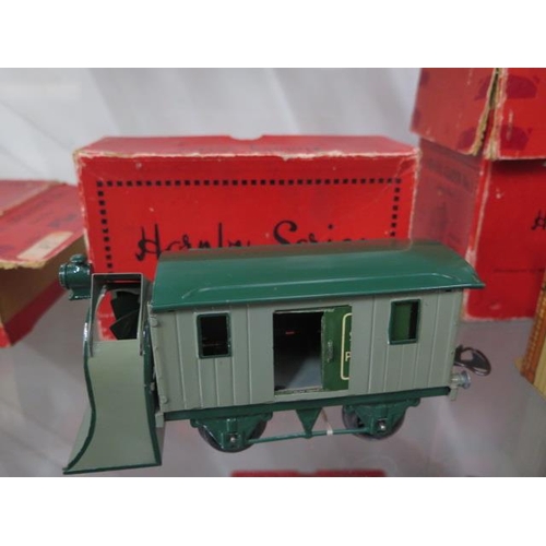 334 - A Hornby tinplate O gauge Snow Plough, a Signal Cabin and a Level Crossing - all boxed