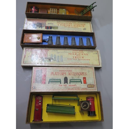 336 - Three boxed Hornby O gauge accessory sets, platform accessories, milk cans with trucks and luggage a... 