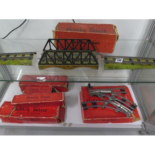 338 - A Hornby O gauge bridge with part box and assorted track