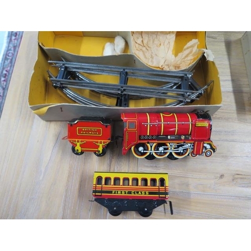 345 - A tinplate mechanical train set with box - almost mint condition