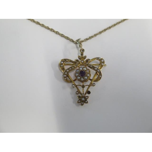 4 - A 9ct gold garnet and pearl pendant on a 9ct gold 60cm chain - total weight approx 9.5 grams - some ... 